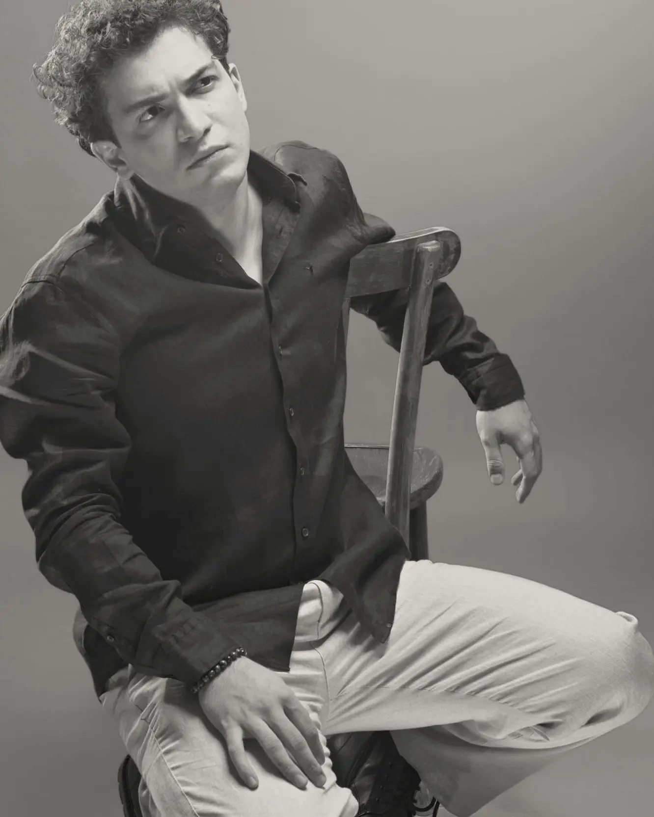 Baritone Biran Özgür Sariyer, studio portrait, black shirt