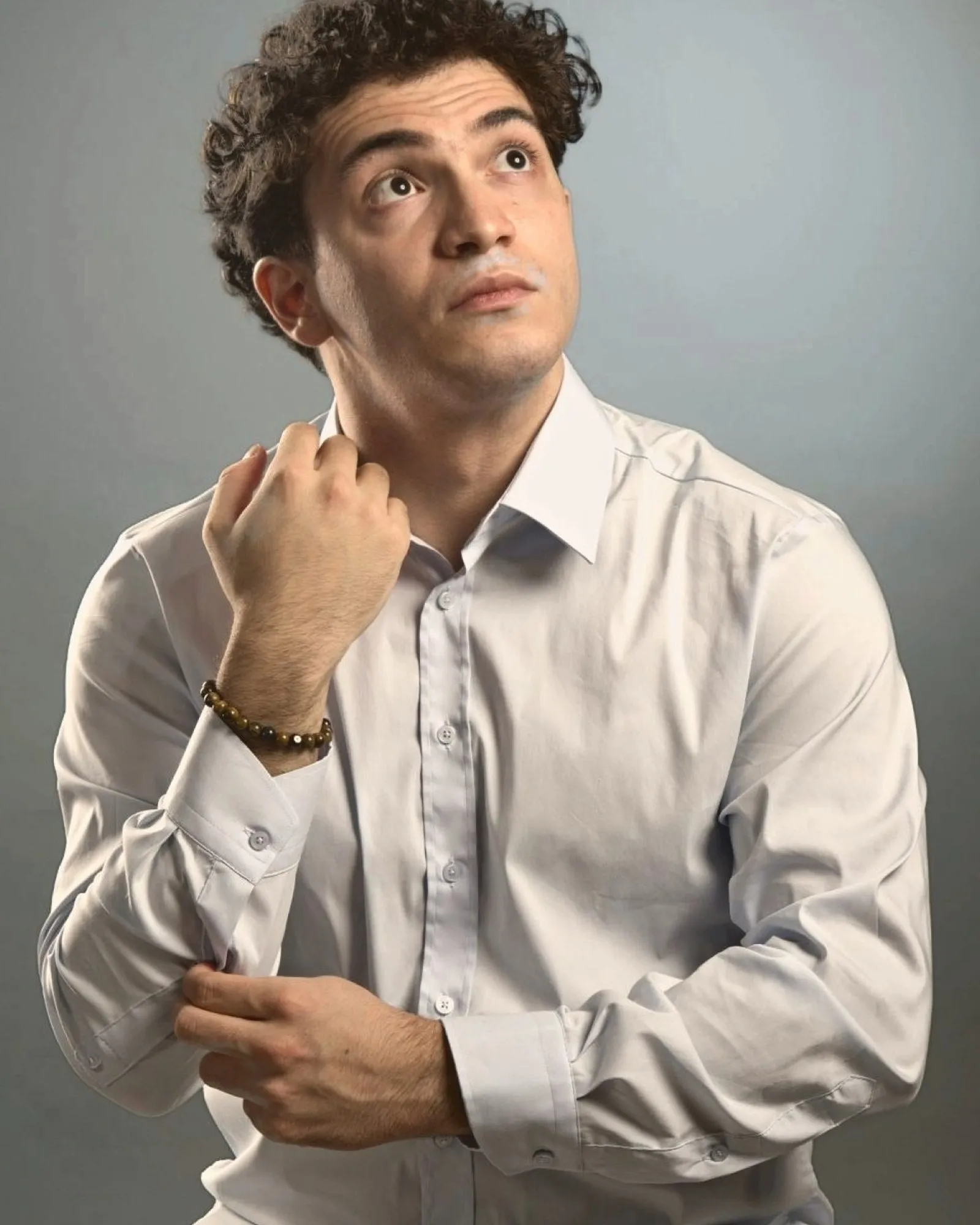 Baritone Biran Özgür Sariyer, studio portrait, thoughtful